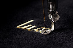 embroidery of gold lettering "luxury" on